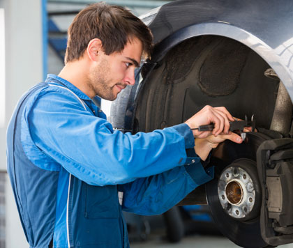 Mechanic working on a brake